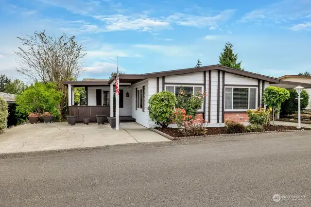 Street view of this well cared for level entry in Heather Hills.