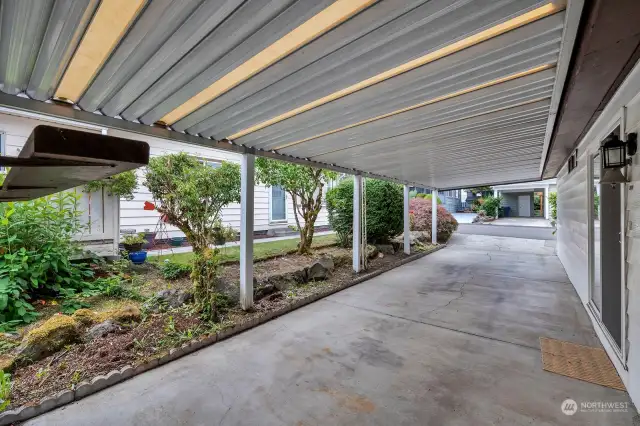 Deep , covered carport with access door into the utility room.