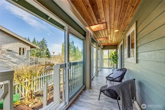 Sun Porch is enclosed with opening windows, great for all seasons