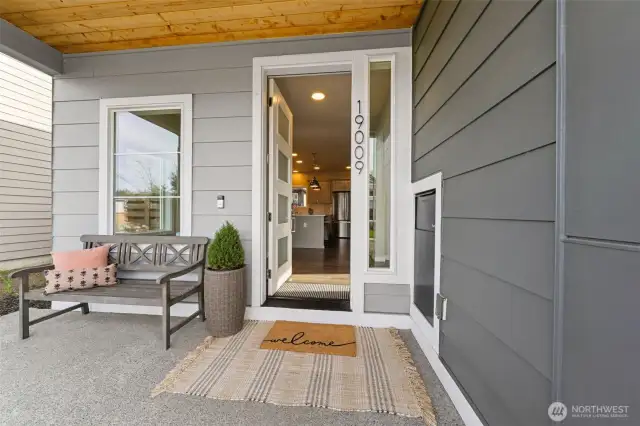 Front porch is perfect for that morning or afternoon reset! On the right is the secure package drop.