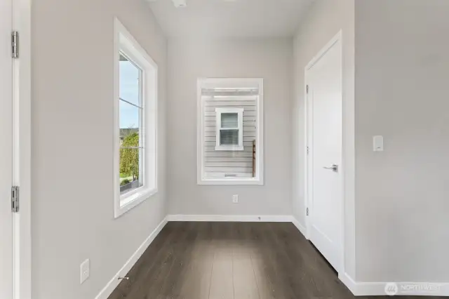As you enter, there is a nice flex space to the left and coat closet