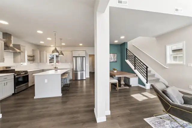 As you enter, the well appointed kitchen & dining with built in banquet, great room to the right.
