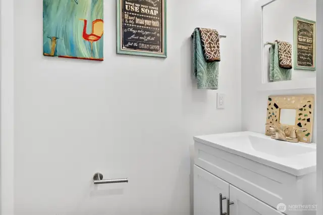 Half bath near primary bedroom door
