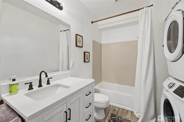 Full Bathroom / Utility Room  Barn door entrance  Quartz counters    Stackable washer and Dryer    Storage shelves    Storage area