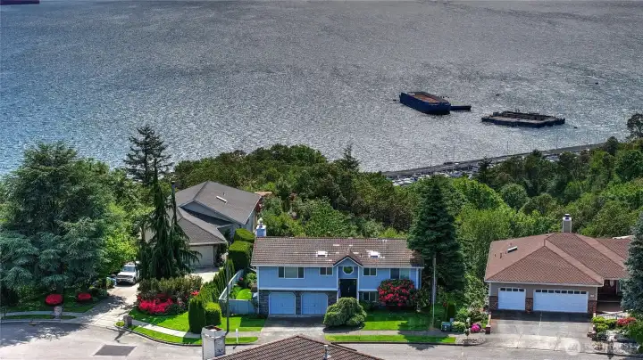 Watch the ships come in this high banked home