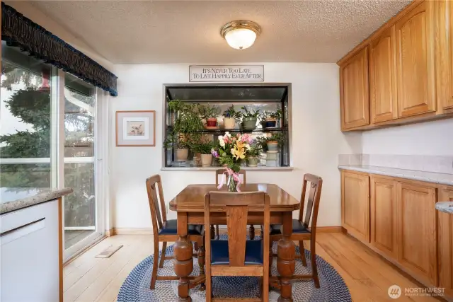Kitchen table sits in front of the slider to enjoy the views