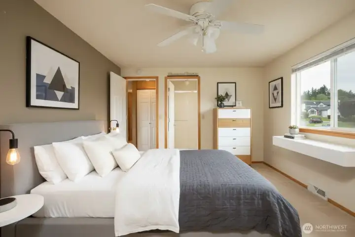 Virtually staged Primary bathroom if to the right of the bedroom entry