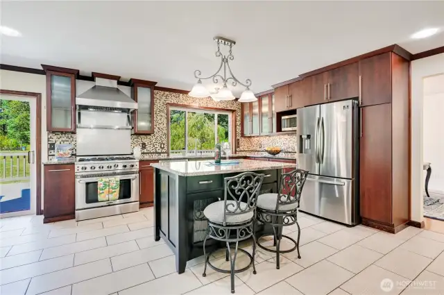 Kitchen Features Large Stove/Oven, Island, Pantry and Stainless-Steel Appliances