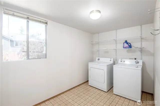 Large laundry room with washer and dryer