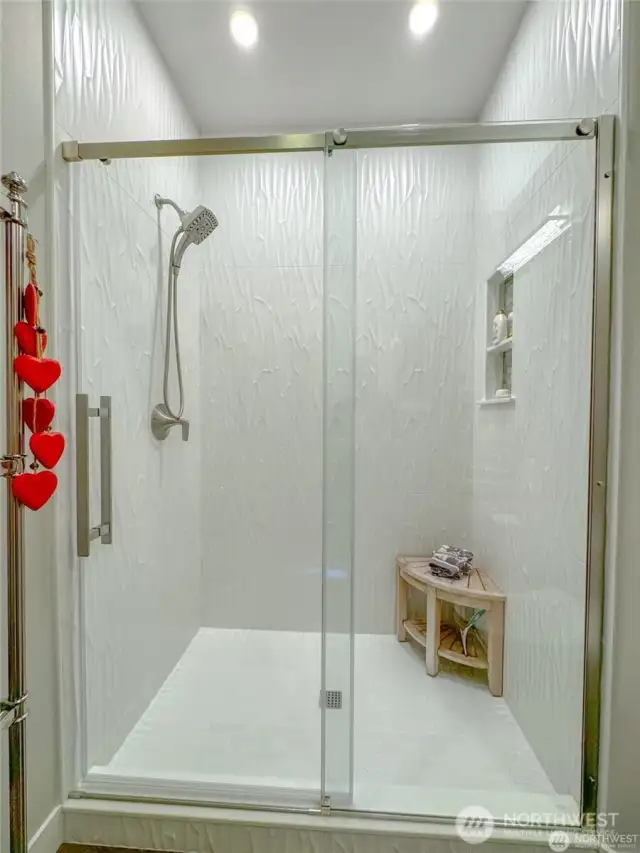 Main bath shower, gorgeous tile surround is used in both bathrooms.