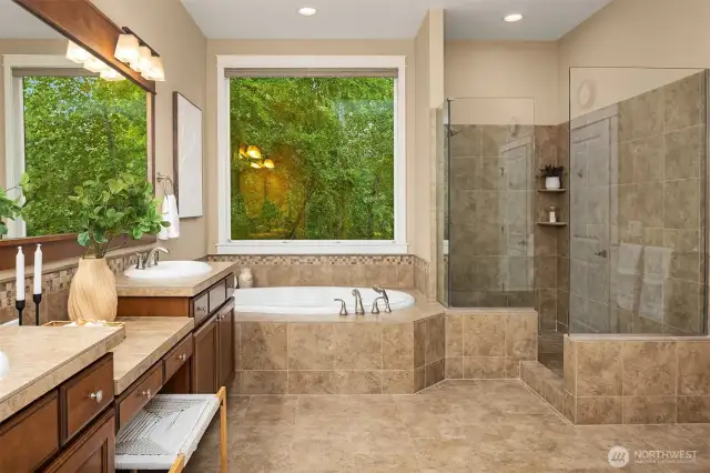 Primary Suite with soaking tub, dual vanities, large shower and grand walk in closet.