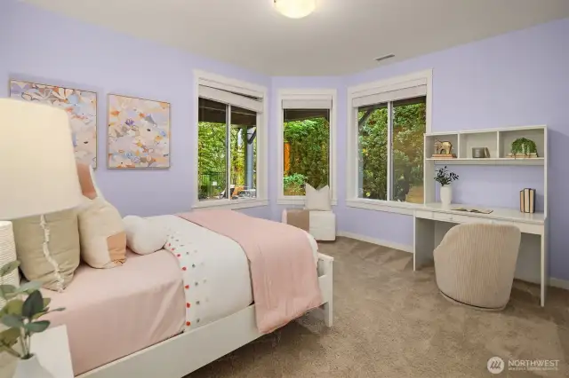 Lower level guest bedroom with ensuite bathroom.