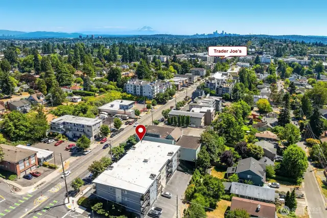 Great Greenwood location with Trader Joes nearby as well as places to grab a bite to eat + shops.  Note the green lines on the street - designated bike path on Greenwood. Also, there's 4 guest parking spots in the back of the complex which is shown in this photo.