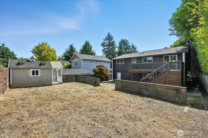Backyard with tool shed.
