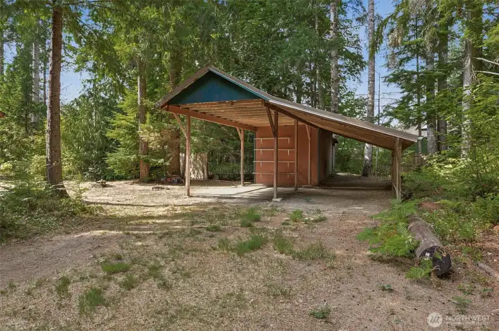 Large RV carport with a storage shed on the back side.