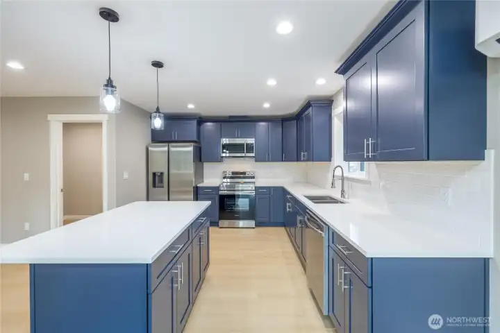 Look at that kitchen! Quality soft close cabinets.