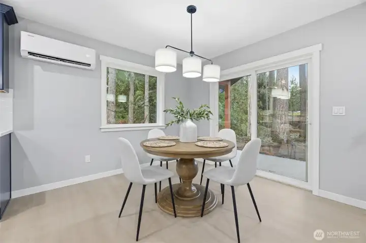 Dining area with slider to the covered patio.