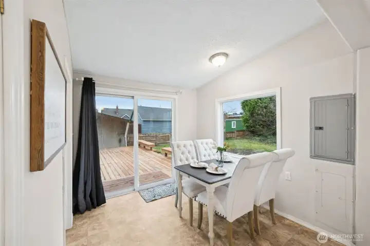Dining area opens to oversized deck.