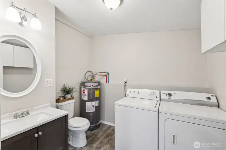 Main level half bathroom and laundry room