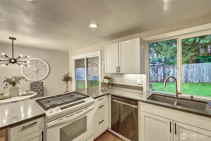 The sliding glass door gives you access to the back yard and spacious side yard.