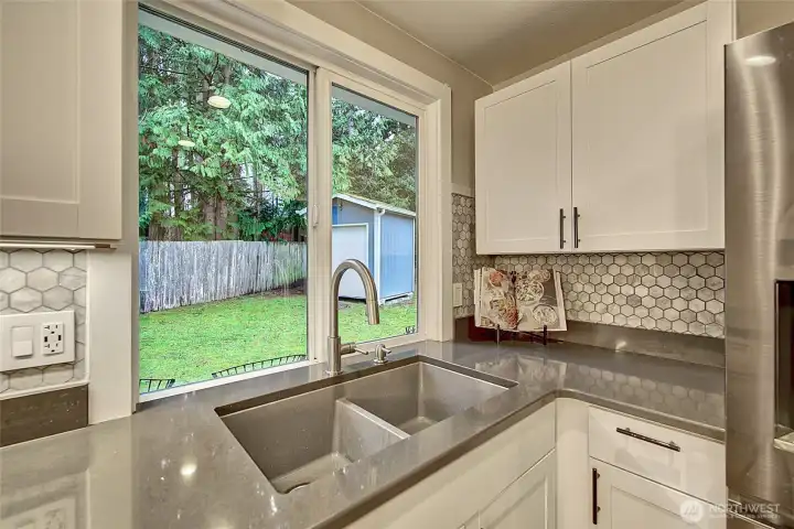 Enjoy the view of your back yard at your kitchen sink.