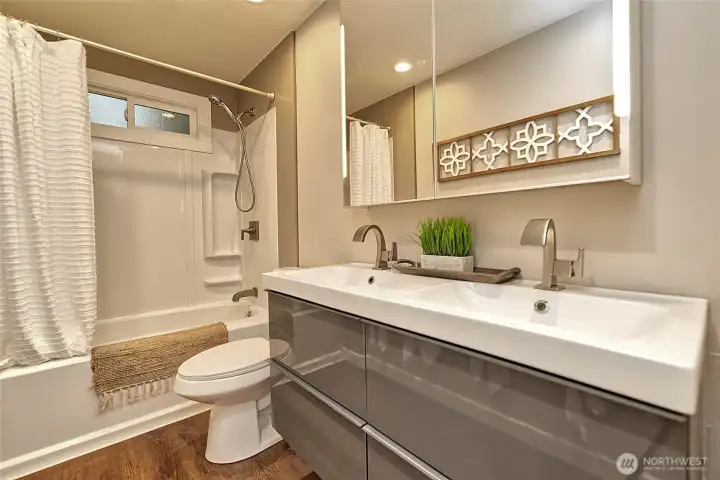 The bathroom has had recent updating! Great floating vanity with double sink!