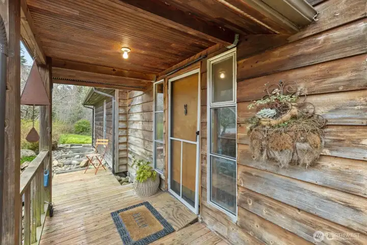 Let's go inside.  The modest, cedar-clad home has 2 bedrooms, and is 2079 square feet  with 1839 on the main floor (not counting the 513 sqft basement).  The primary suite is on the main floor as well!