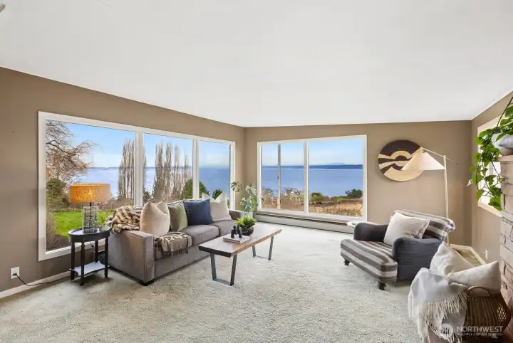 The living room, with the Kingston/Edmonds ferry, marine traffic, and Cascades in the background.