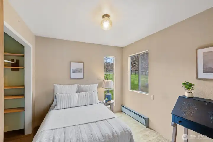 The second bedroom is at the opposite corner of the house from the primary bedroom.