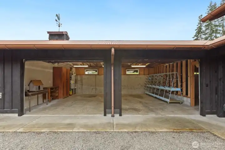 The left side of the garage (water side) is finished space, the center is garage space for 2 cars, and the right side is shop storage and has an isolated welding bay.