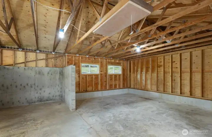 The right side, with welding bay and storage.  There is a sliding barn toor that opens int he breezeway directly to the workshop.