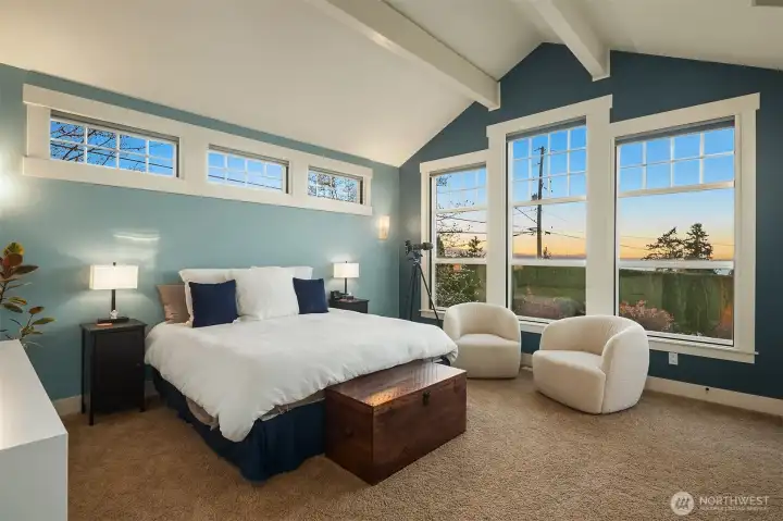 Generous Primary Suite with vaulted ceilings and own gas fireplace.