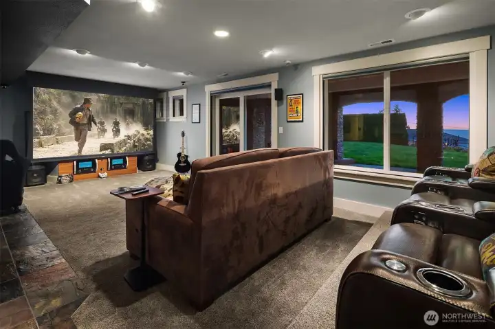 Theater room, entertaining gets no better. Projector and screen. Wet bar and fridge. Dumbwaiter to & from kitchen for ease.