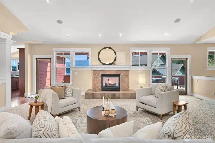 Large living room perfect for entertaining.  It has a double sided gas fireplacee shared by the deck.