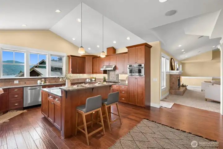 There is plenty of room in this functional, bright, and inviting kitchen with fantastic lake views