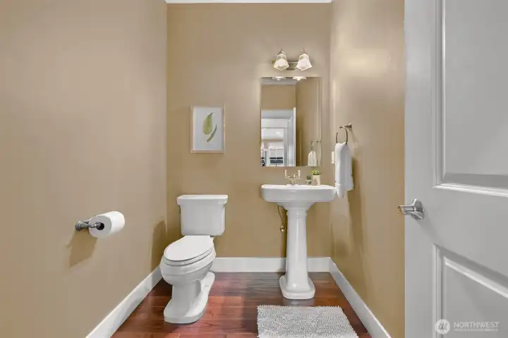 Guest half bath to the right of the butler's pantry