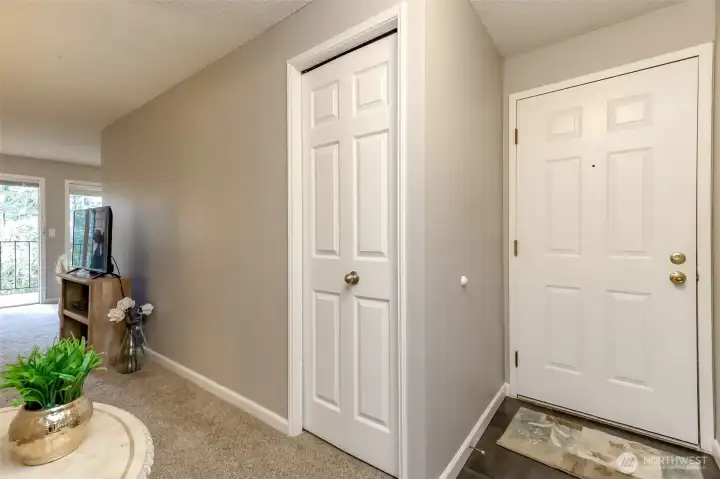 Welcoming entryway with coat closet, clean finishes, and easy flow into the main living area.