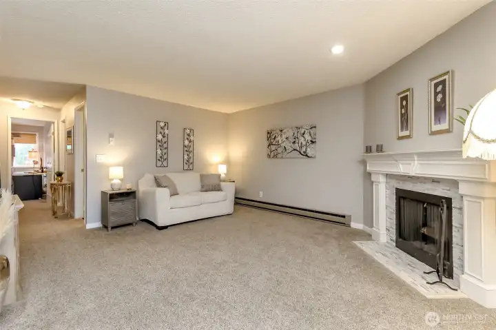 Large living room with cozy fireplace, open layout, and plenty of space for entertaining or relaxing at home.