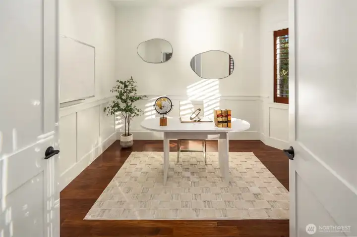Private office on the main with refined finishes—ideal for focused work and quiet productivity.