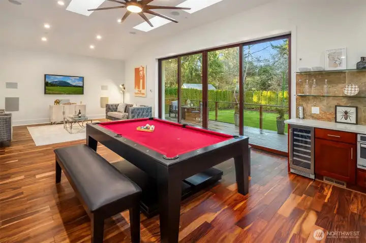 Spacious entertainment lounge with built-in grill and large pool table—designed for unforgettable gatherings.