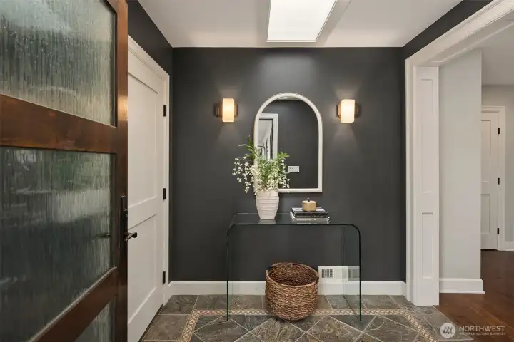 A composed first impression—clean lines, thoughtful contrast, and a sense of calm the moment you step inside. It sets the tone for the home: intentional, warm, and quietly refined.