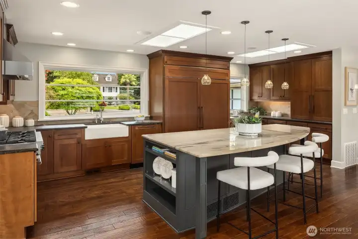 The heart of the home—where morning light filters through skylights, coffee is poured at the island, and everyday moments gather with ease.