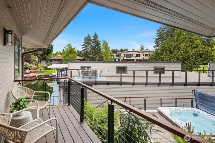 An intimate perch within a larger outdoor composition—overlooking the rooftop deck and canal, where each level offers its own moment.