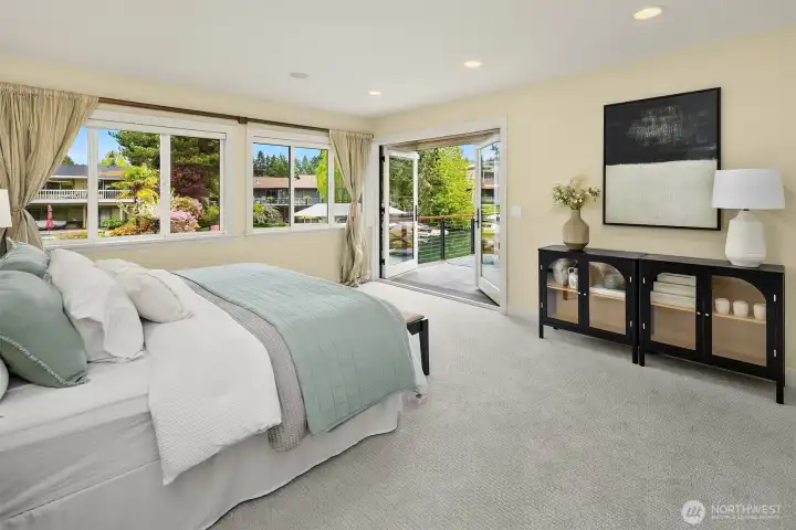 Wake to the stillness of the canal and step outside—this is a primary suite designed around light, air, and effortless indoor-outdoor living.