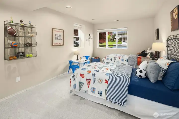 A bright and inviting bedroom with soft natural light and tranquil views—ideal for guests or everyday living.