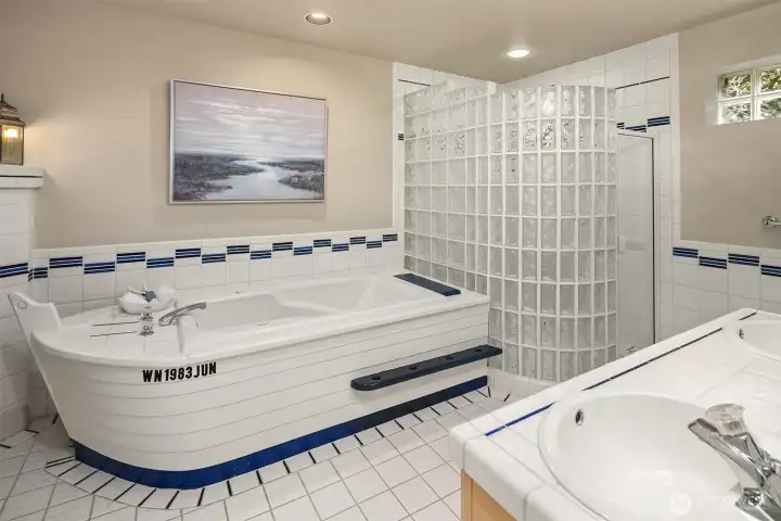 A playful, nautically inspired hall bath—thoughtfully designed with custom details that subtly echo the home’s waterfront setting.