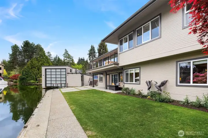 From the lower level, step directly out to a level lawn that meets the water’s edge—an extension of the home designed for relaxed, everyday living. Ideal for guests, play, or quiet mornings by the canal, with easy access back to the home above and the rhythm of waterfront life just steps away.