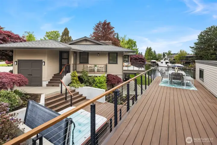 Set above the water, a rooftop deck crowns the fully rebuilt boathouse—part of a 1,400 SF floating Trex decking system designed for sunset dinners, morning coffee, and long, unhurried days on the canal.