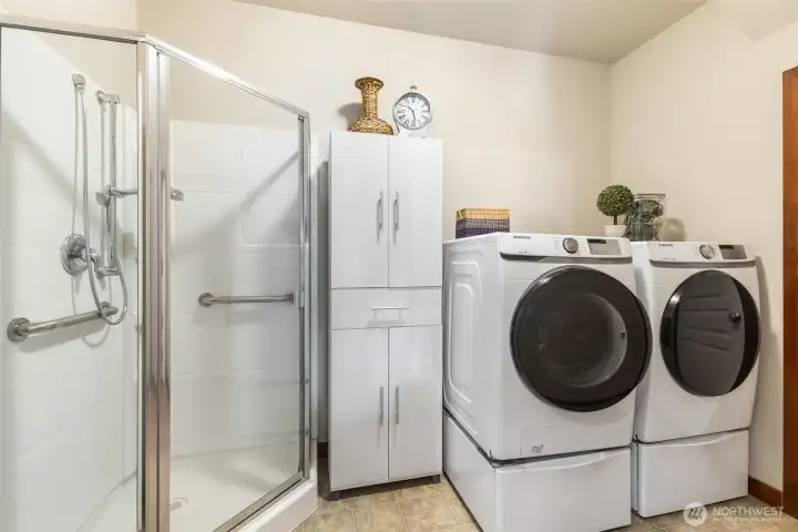 Main Floor Laundry with Shower (perfect for a pet shower) and Large Storage Closet