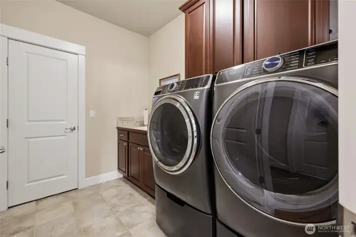 Laundry room with door into Primary walk in closet